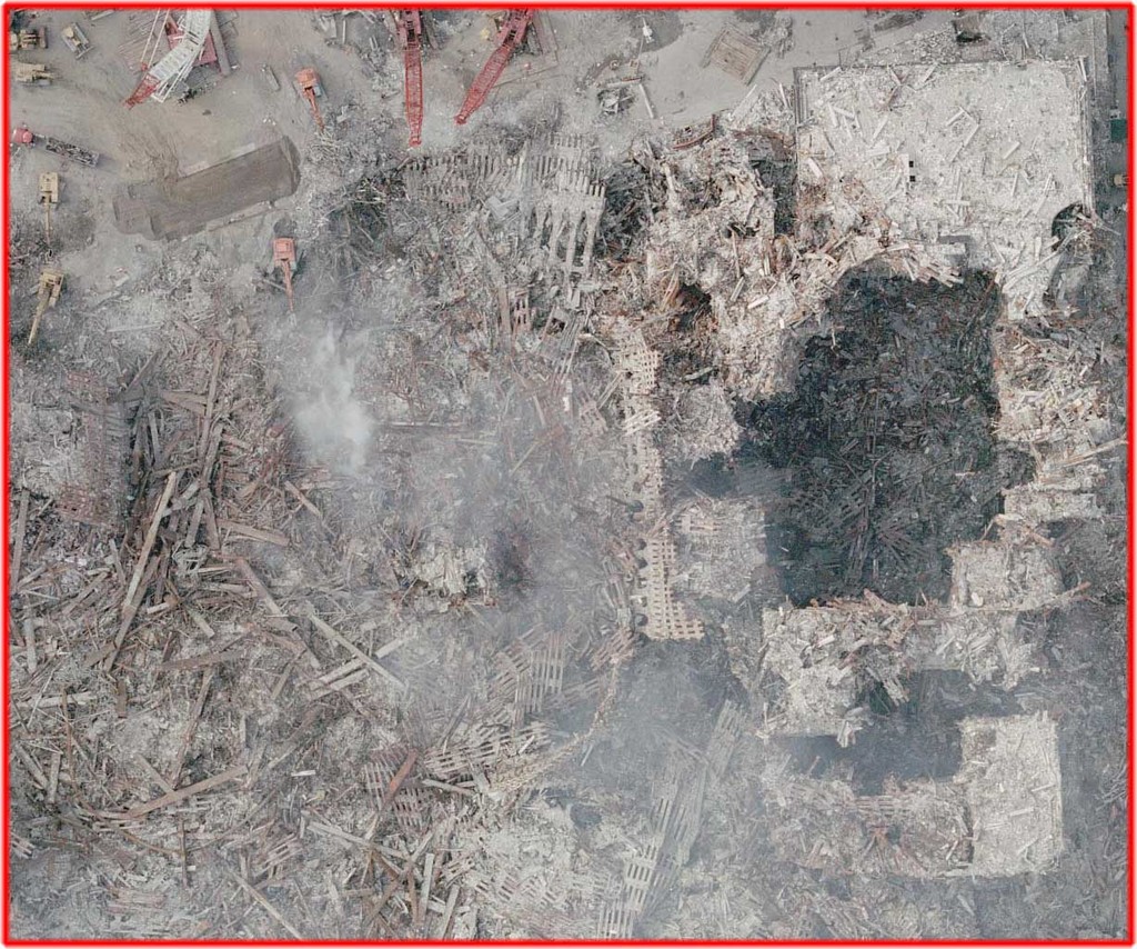 This shows the vertical cut-outs in the center of WTC-6. To the left of WTC-6 are the remains of WTC-1. Note the fairly consistent diameter of the holes. The holes are essentially empty: little debris visible inside the holes.