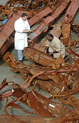 researchers with steel from World Trade Center